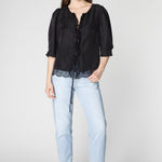 Blusa Witty de la marca P-2025-623, diseño moderno y casual, con manga larga y cuello redondo, en color negro.