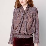 Blusa Maine de la marca O-2025-600, blusa de manga larga en color blanco con detalles elegantes.