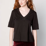 Polera cassie de la marca EI-2025-501, blusa de manga larga en color gris con detalles en el cuello y puños.