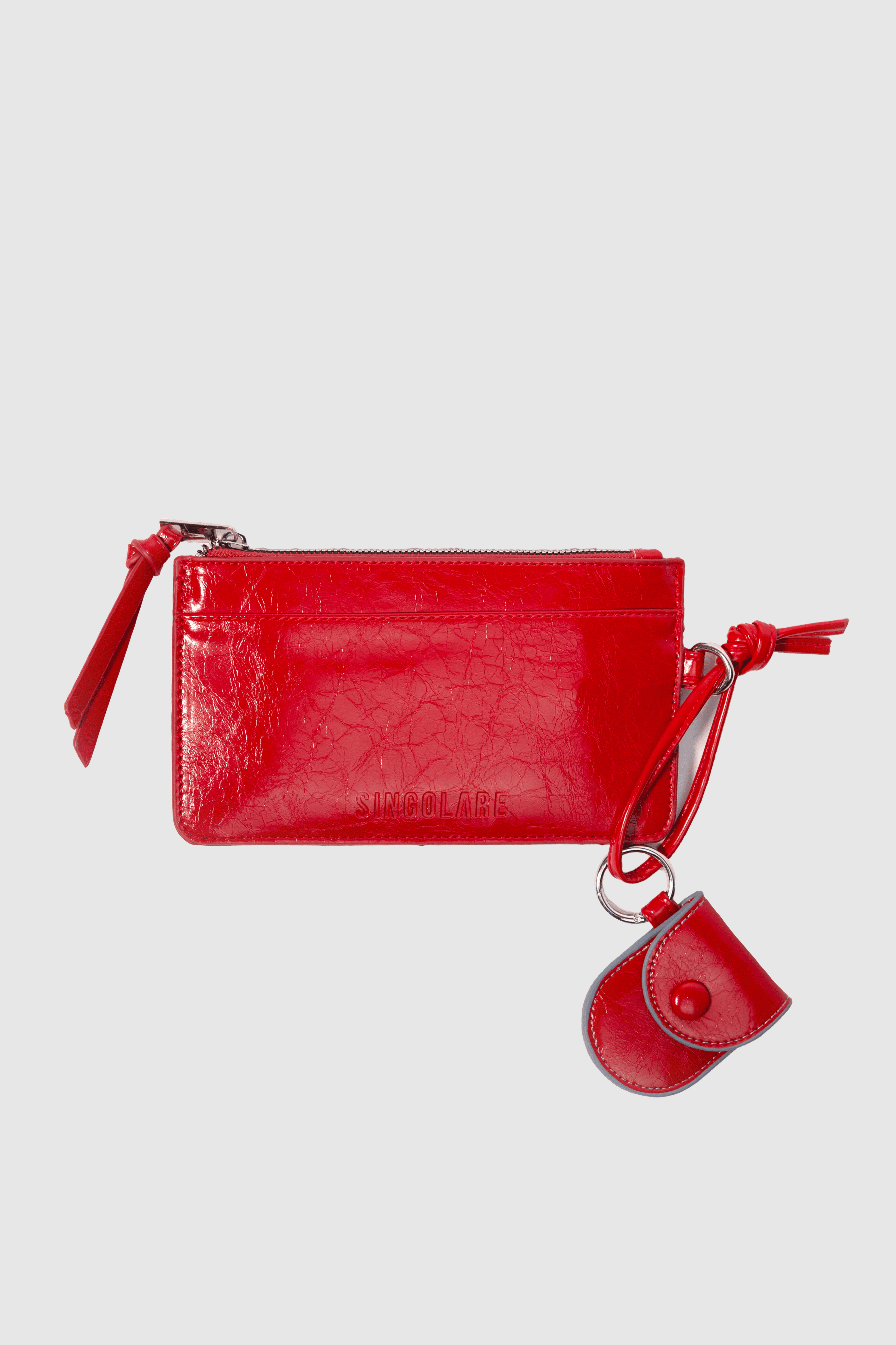 Billetera Isabelle en color rojo de la marca AI-2025-301, con diseño elegante y compartimentos para tarjetas y dinero.
