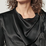 Blusa Atena de la marca I-2024-639, vista frontal con cuello y mangas largas, en color neutro sobre fondo claro.