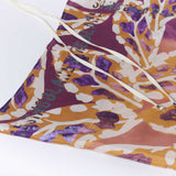 Pareo Tahiti de la marca PA-2025-07, pañuelo ligero con estampado tropical en colores vibrantes, sobre fondo blanco.