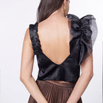 Blusa violeta de la marca FI-2024-605, con diseño de manga larga y cuello redondo, sobre fondo neutro.