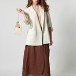 Falda Meliade de la marca P-2026-400, diseñada en tela ligera con detalles elegantes y estilo moderno.