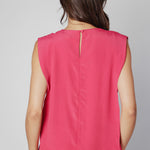 Blusa Agama de la marca V-2025-633 en color azul, con diseño de manga larga y cuello redondo, sobre fondo blanco.