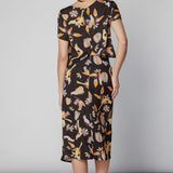 Falda larga Kommi de la marca V-2025-431, en color negro con diseño elegante y detalles en la parte superior.